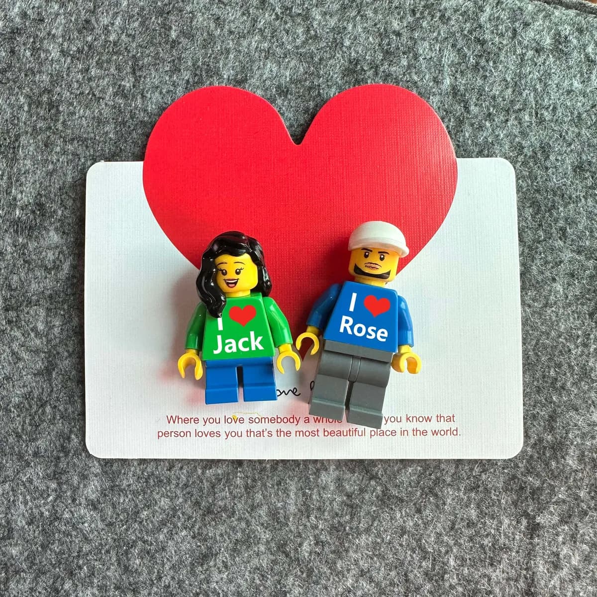 Two personalized brick figures reading I love Jack and I love Rose on a red heart card